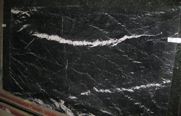 A black marble slab with white lines on it