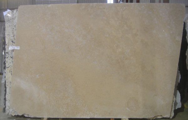 A large piece of stone is sitting on a wooden stand.
