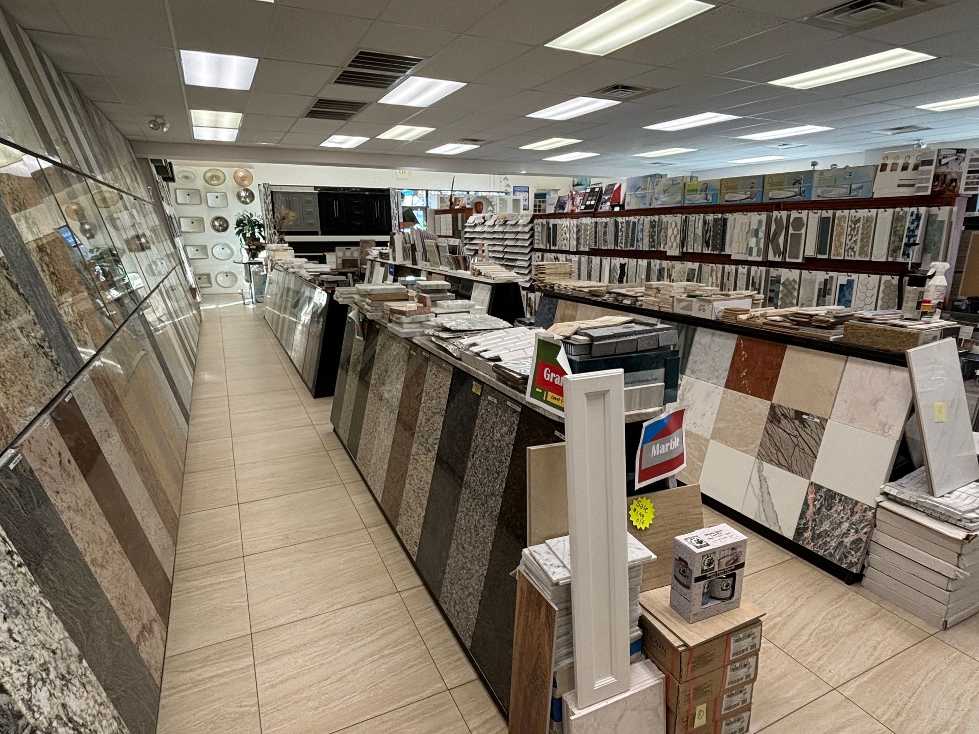 A tile store filled with lots of tiles and boxes.