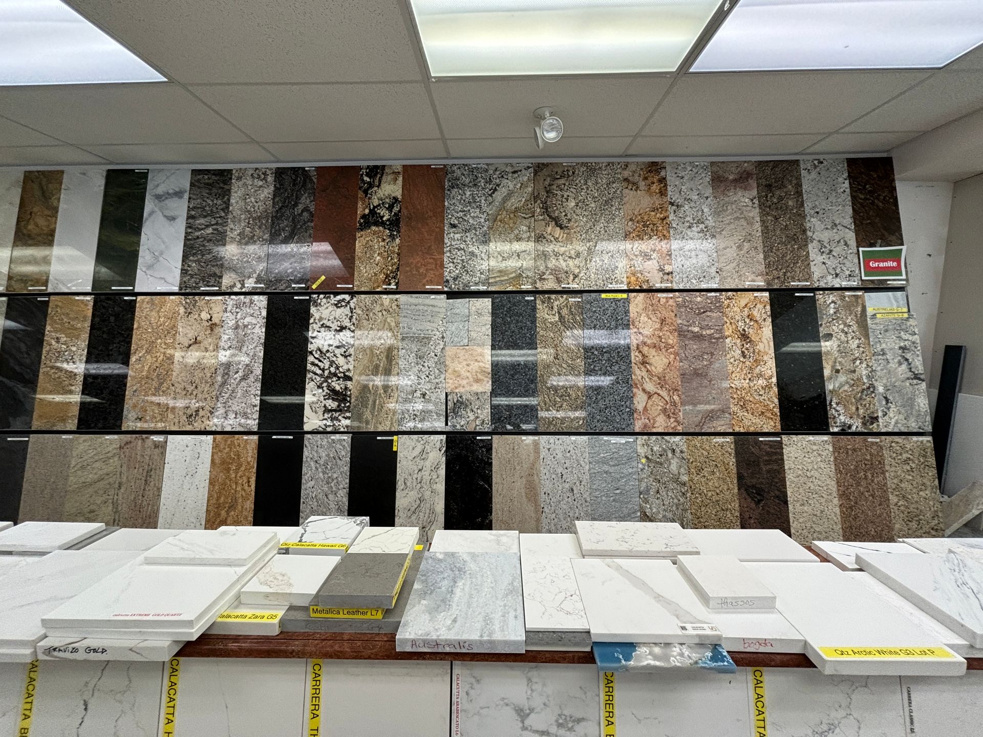 A variety of granite tiles are on display in a store