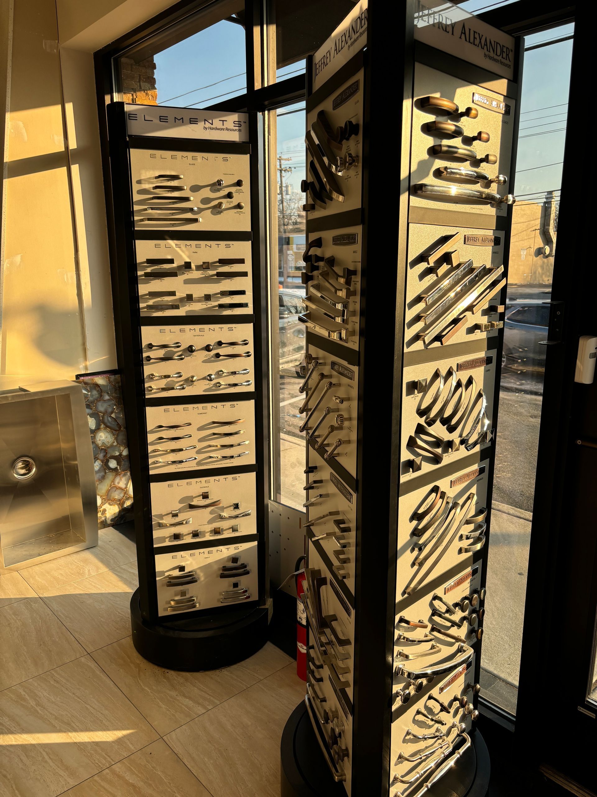 A display of door handles and knobs in a store.