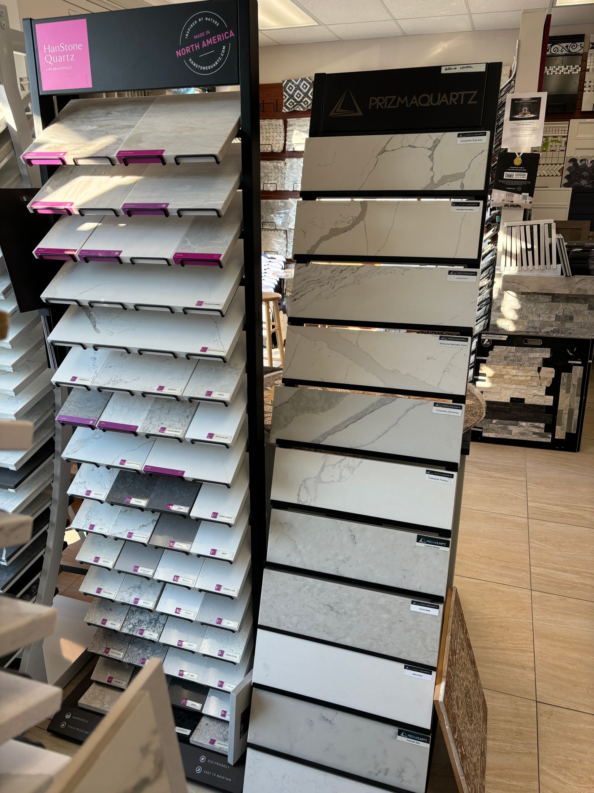 A display of white marble tiles in a store