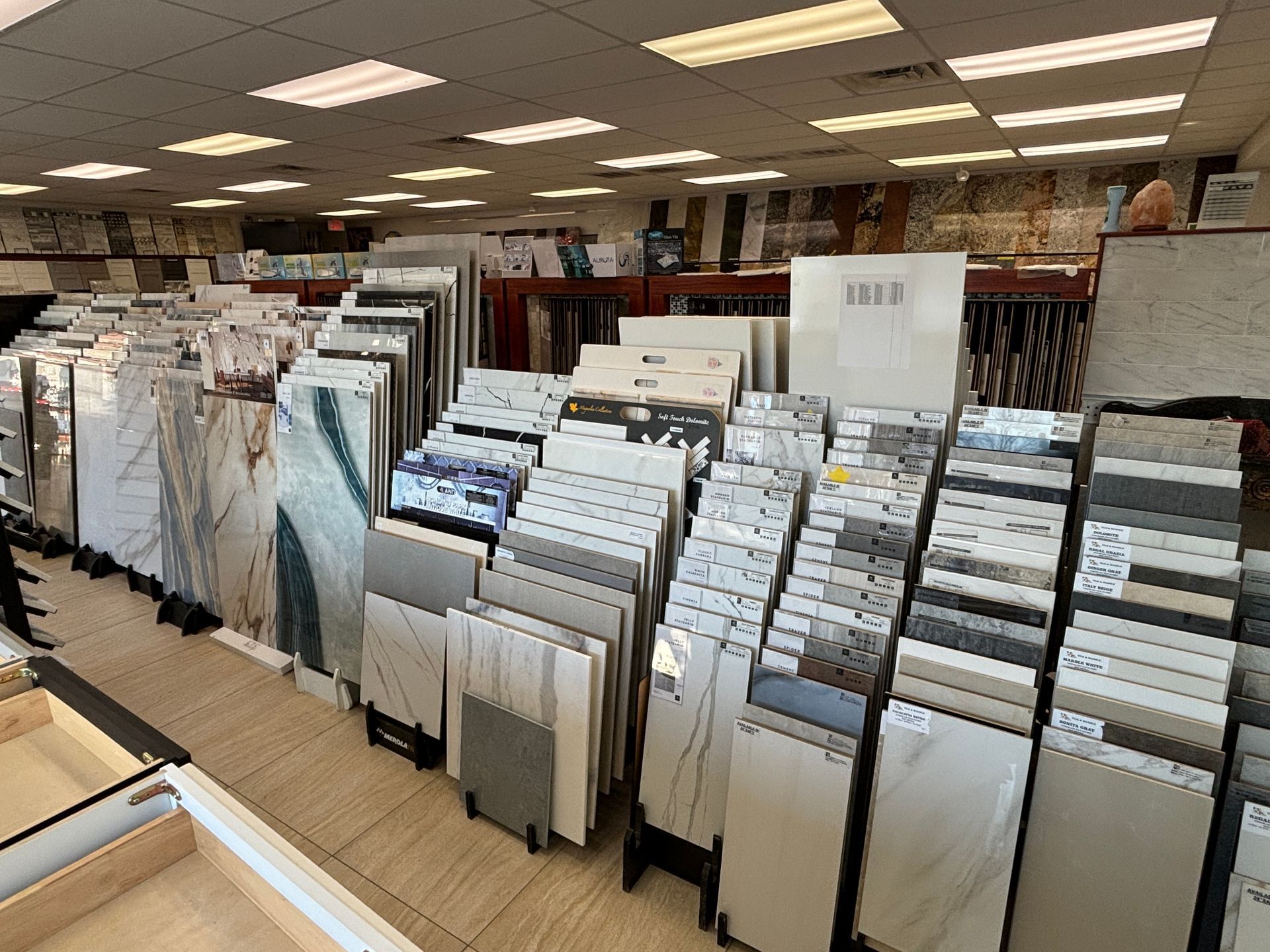 There are many different types of tiles on display in this store.