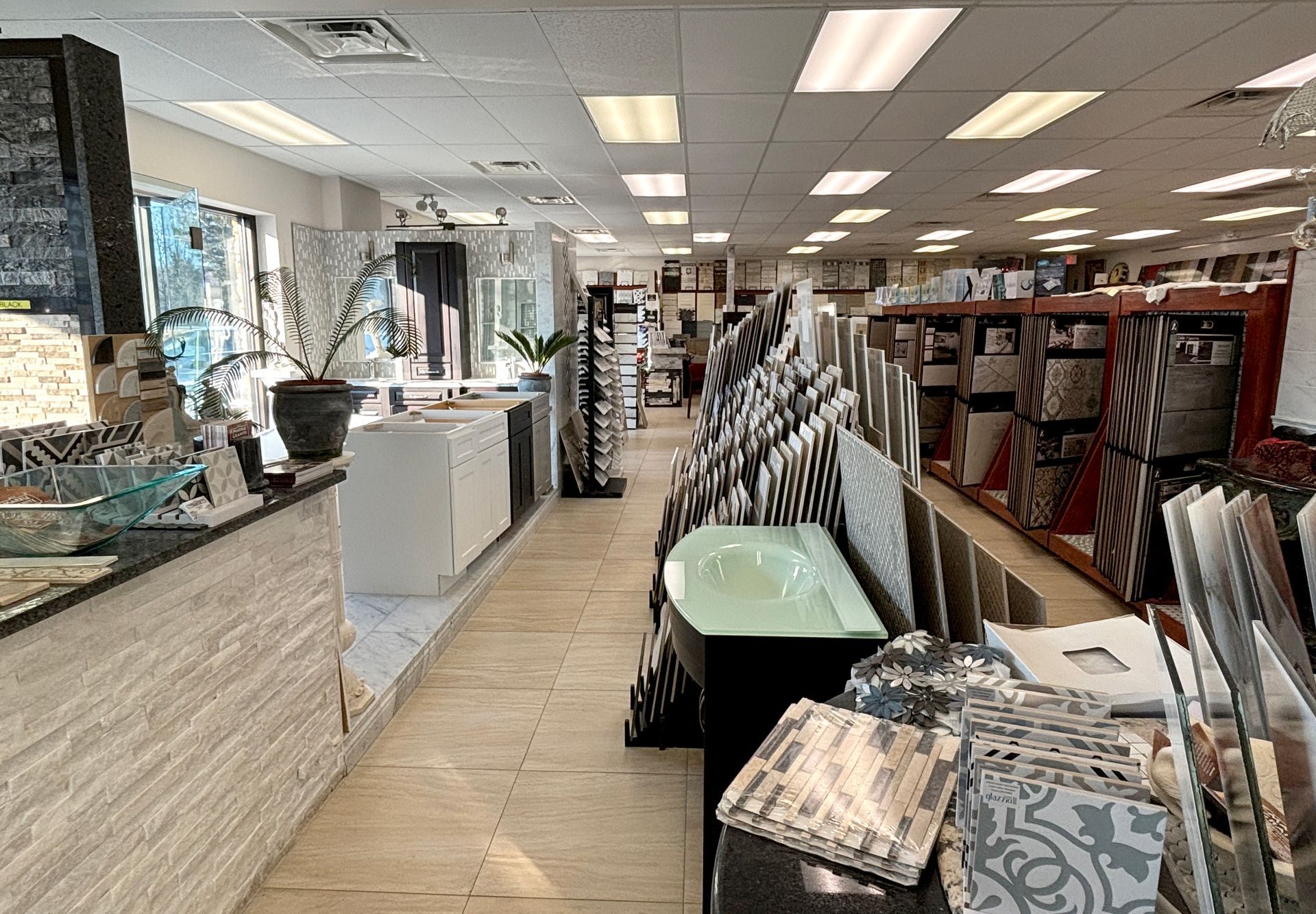 A large bathroom store filled with lots of tiles and sinks.