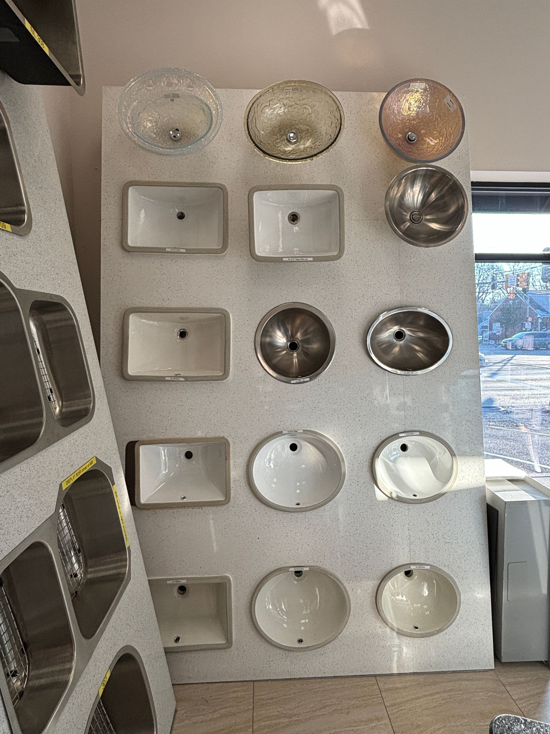 A wall with a bunch of sinks on it