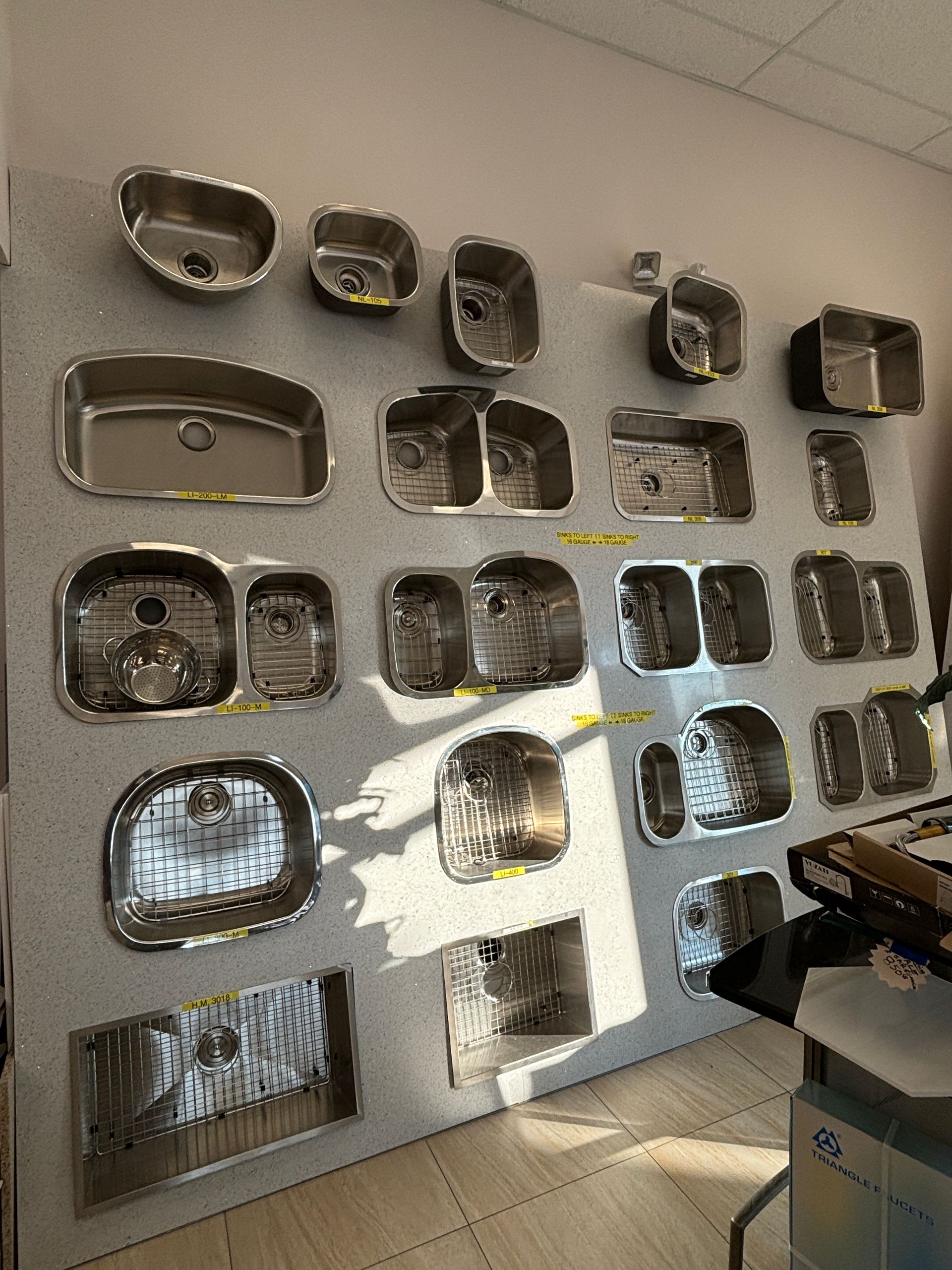 There are many different types of sinks on display in this room.