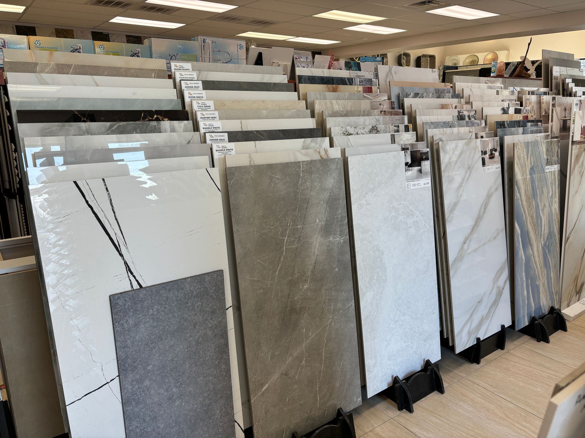 There are many different types of tiles on display in this store.