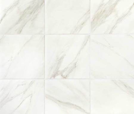 A close up of a white marble tile floor.