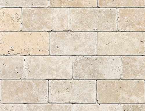 A close up of a white brick wall