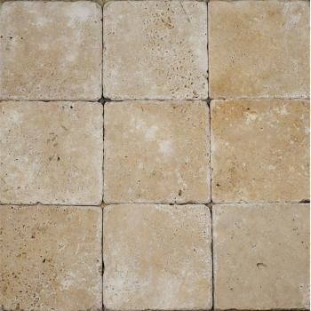 A close up of a tile floor made of square tiles.