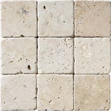 A close up of a stack of square tiles on a white background.