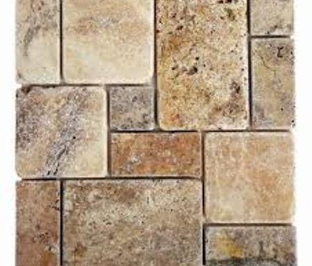 A close up of a tile wall on a white background.