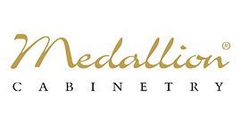 A gold medallion cabinetry logo on a white background.