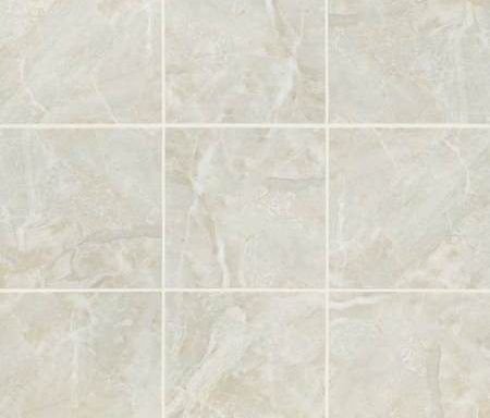 A close up of a tile floor with a marble texture.
