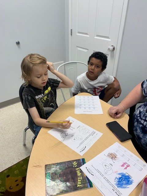 two boys doing school work