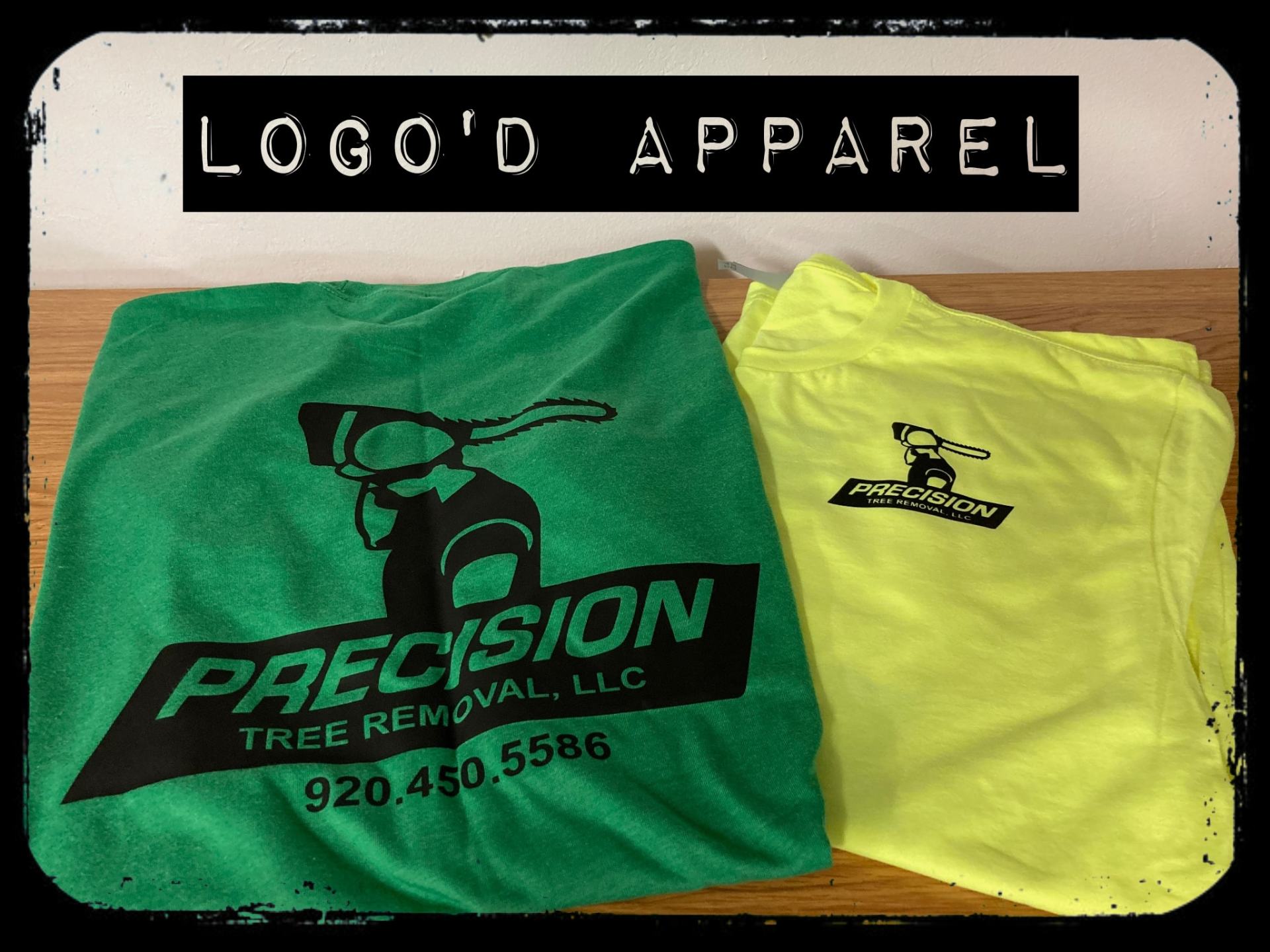 A green and yellow t-shirt for precision tree removal llc