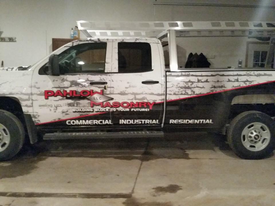 A white truck with the word masonry on the side