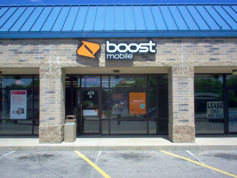 A boost mobile store with a blue roof