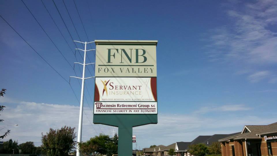 A billboard sign for fnb fox valley servant insurance