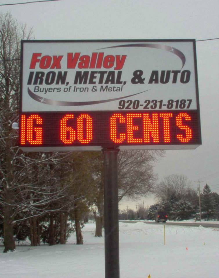 A sign for fox valley iron metal and auto