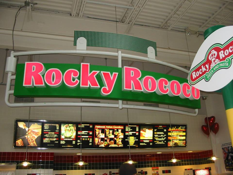 A restaurant with a sign that says rocky rococo