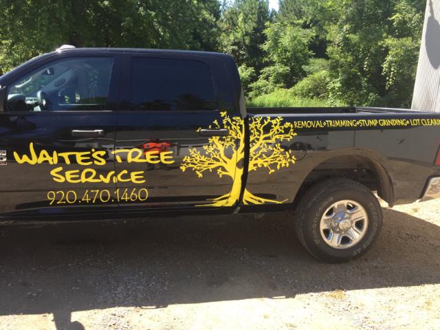 Waite 's tree service is advertised on the side of this truck