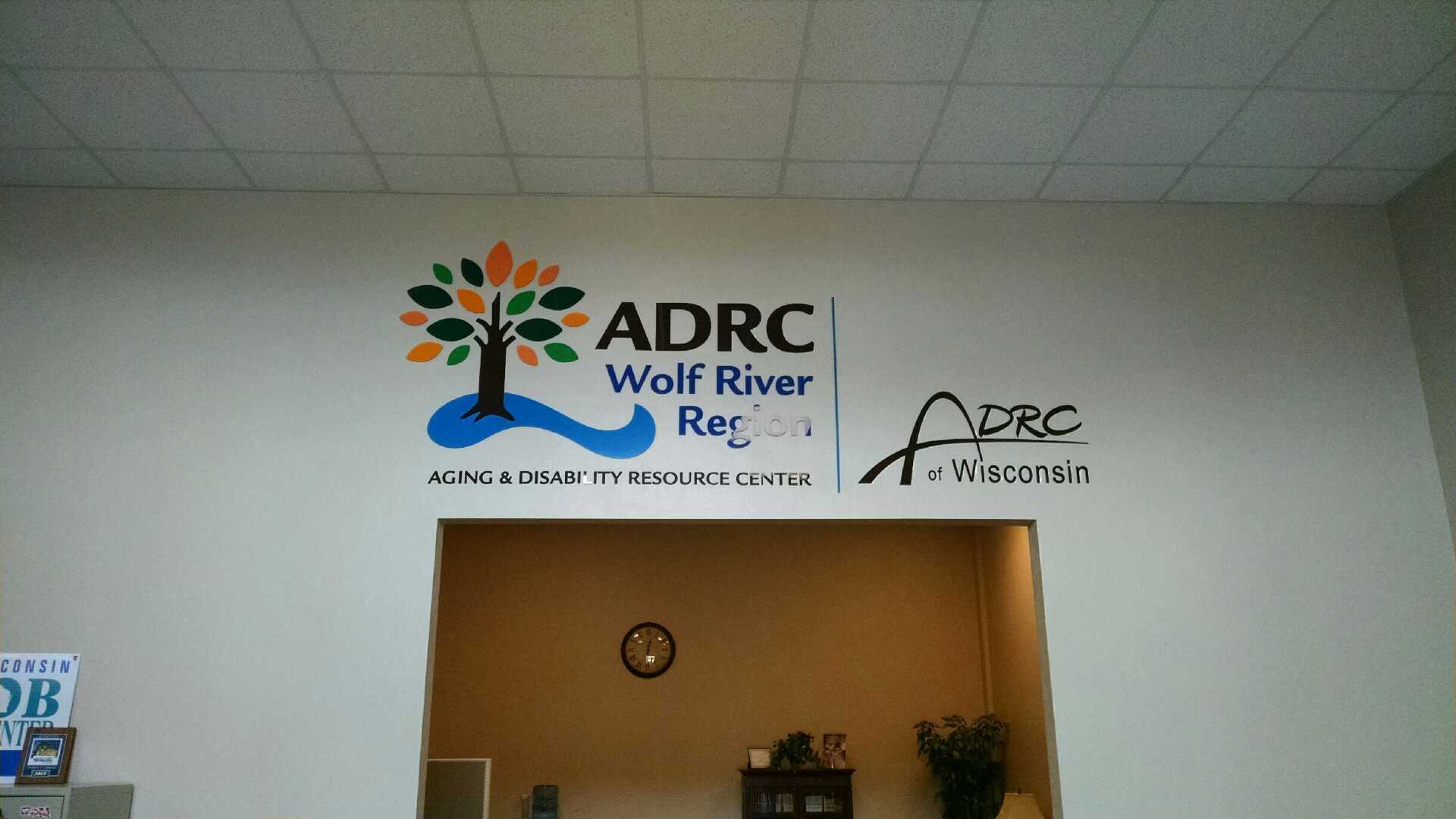 A sign on a wall that says adrc wolf river rec