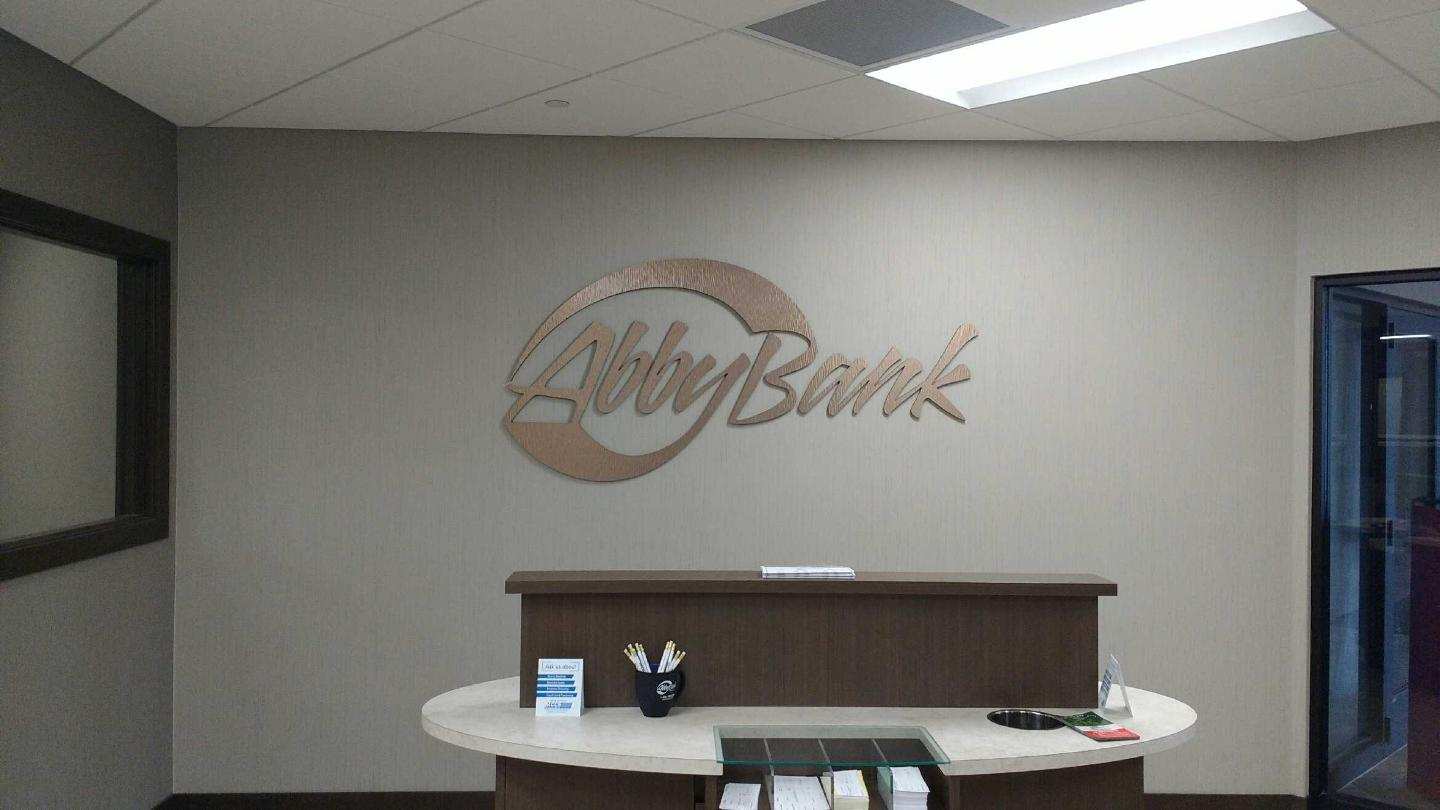 A lobby with a sign on the wall that says lobby bank.