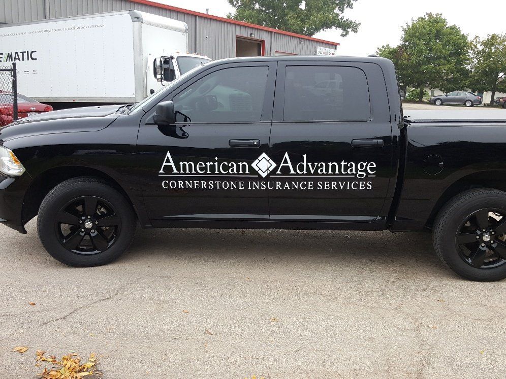 A black american advantage truck is parked in a parking lot