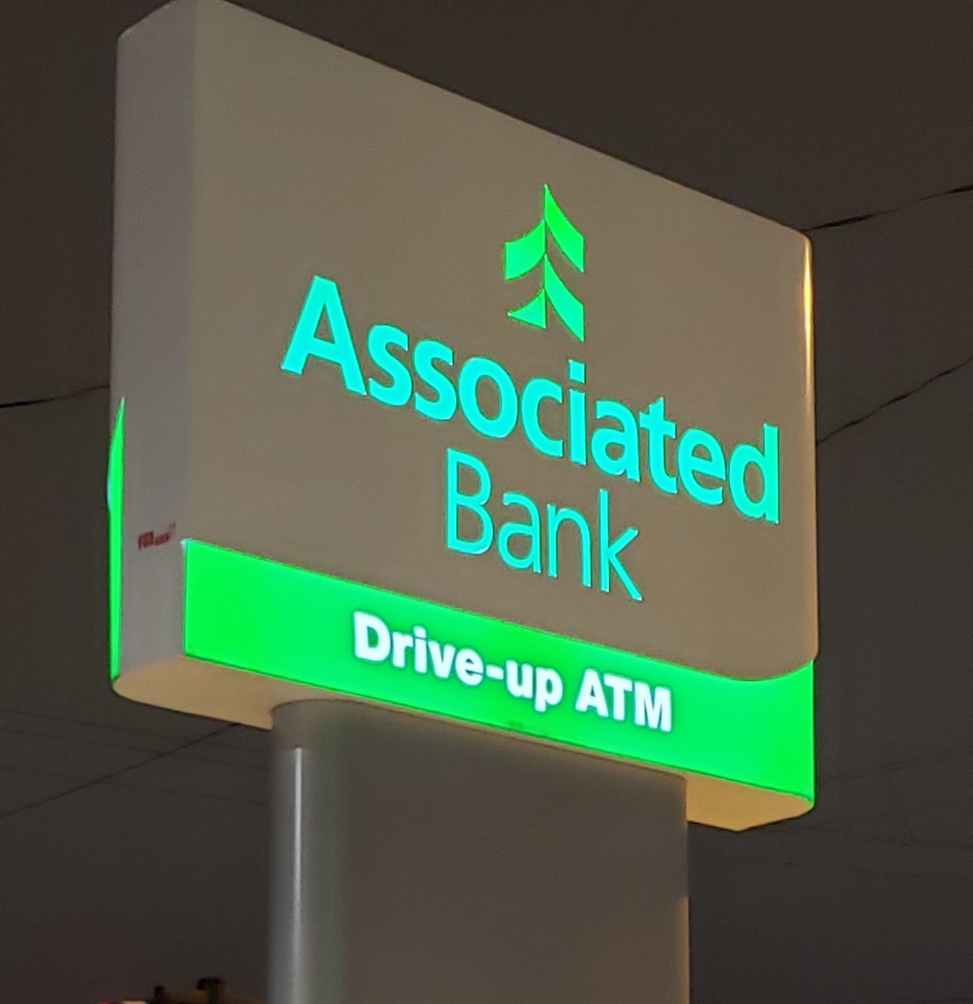 A sign for the associated bank drive-up atm