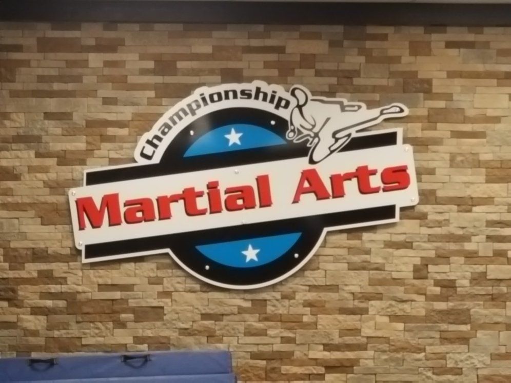 A sign that says martial arts championship on it