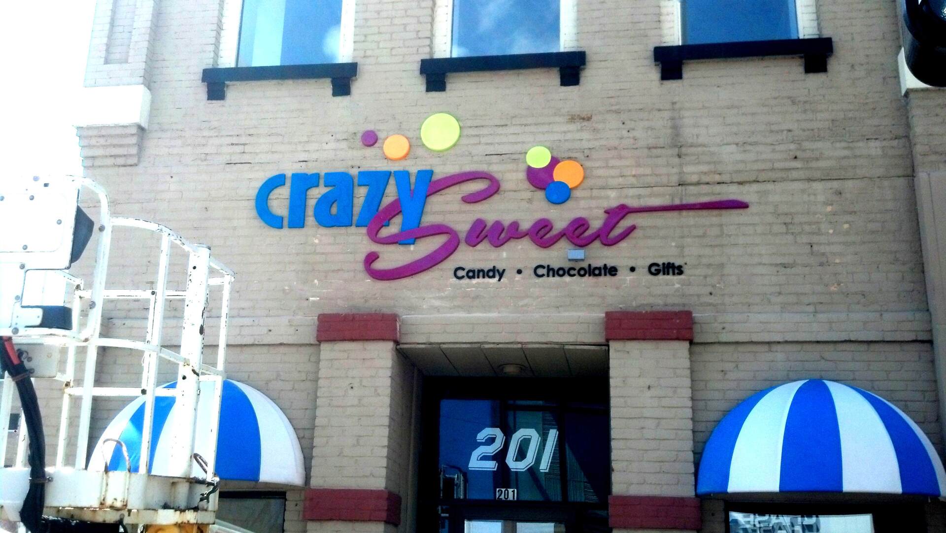 A building with a sign that says crazy sweet on it