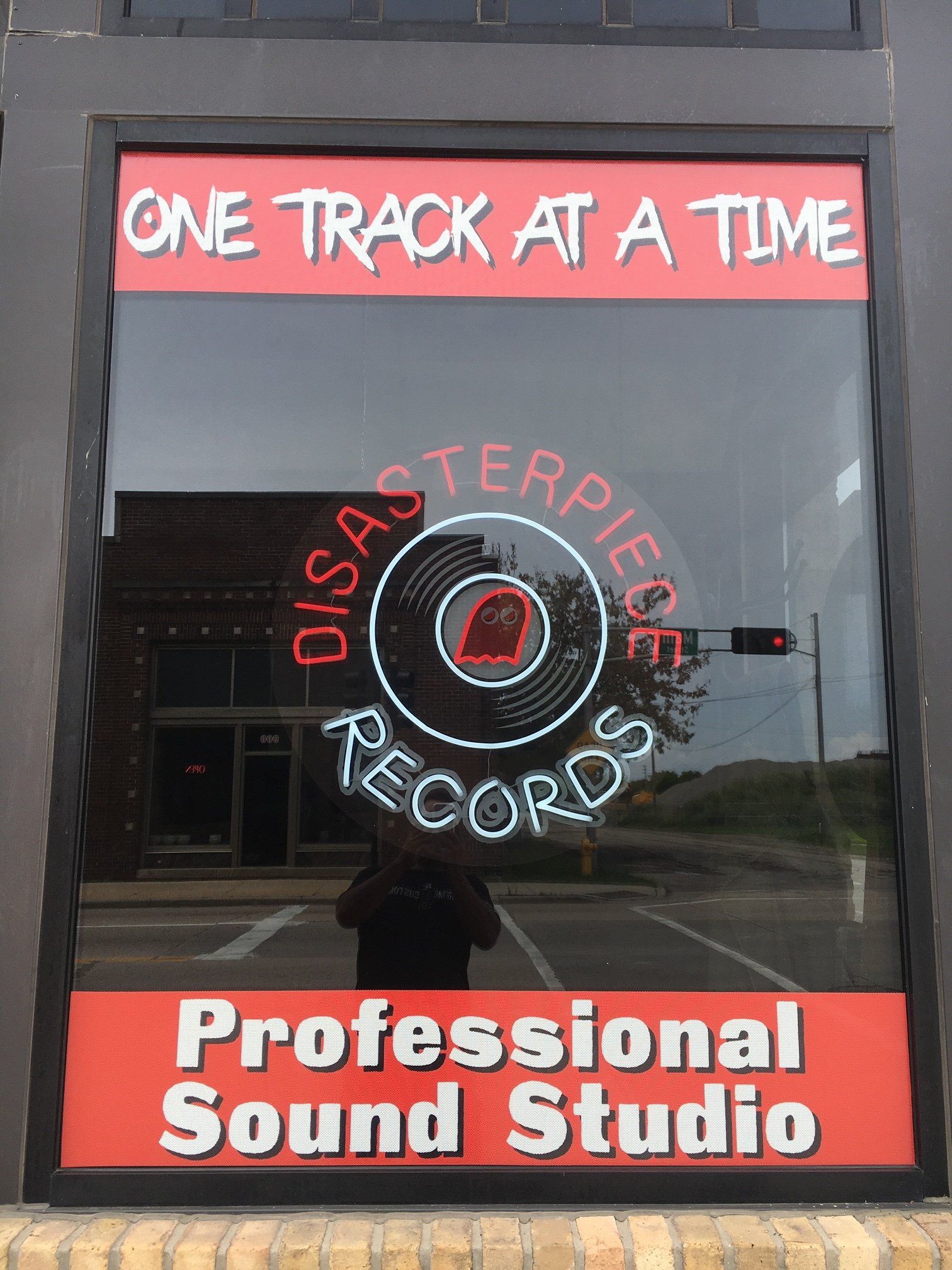 A window that says one track at a time professional sound studio