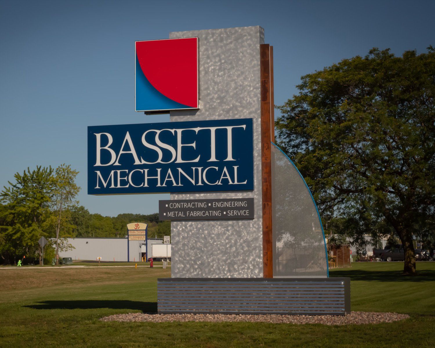 A large sign that says bassett mechanical on it