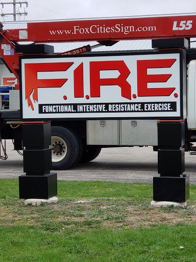 A large red and white sign that says fire on it