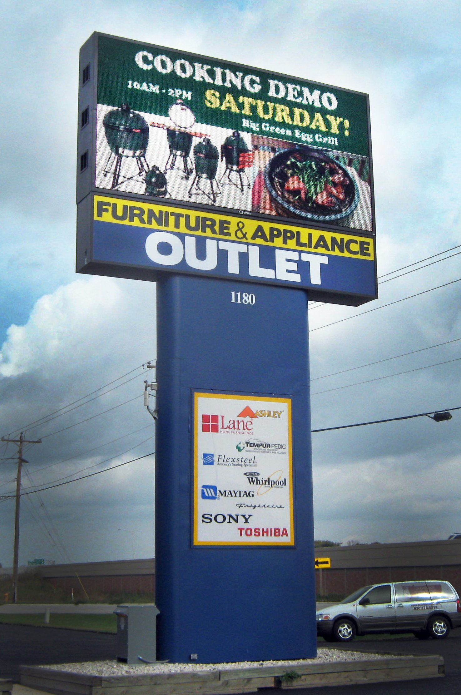 A billboard for a furniture and appliance outlet