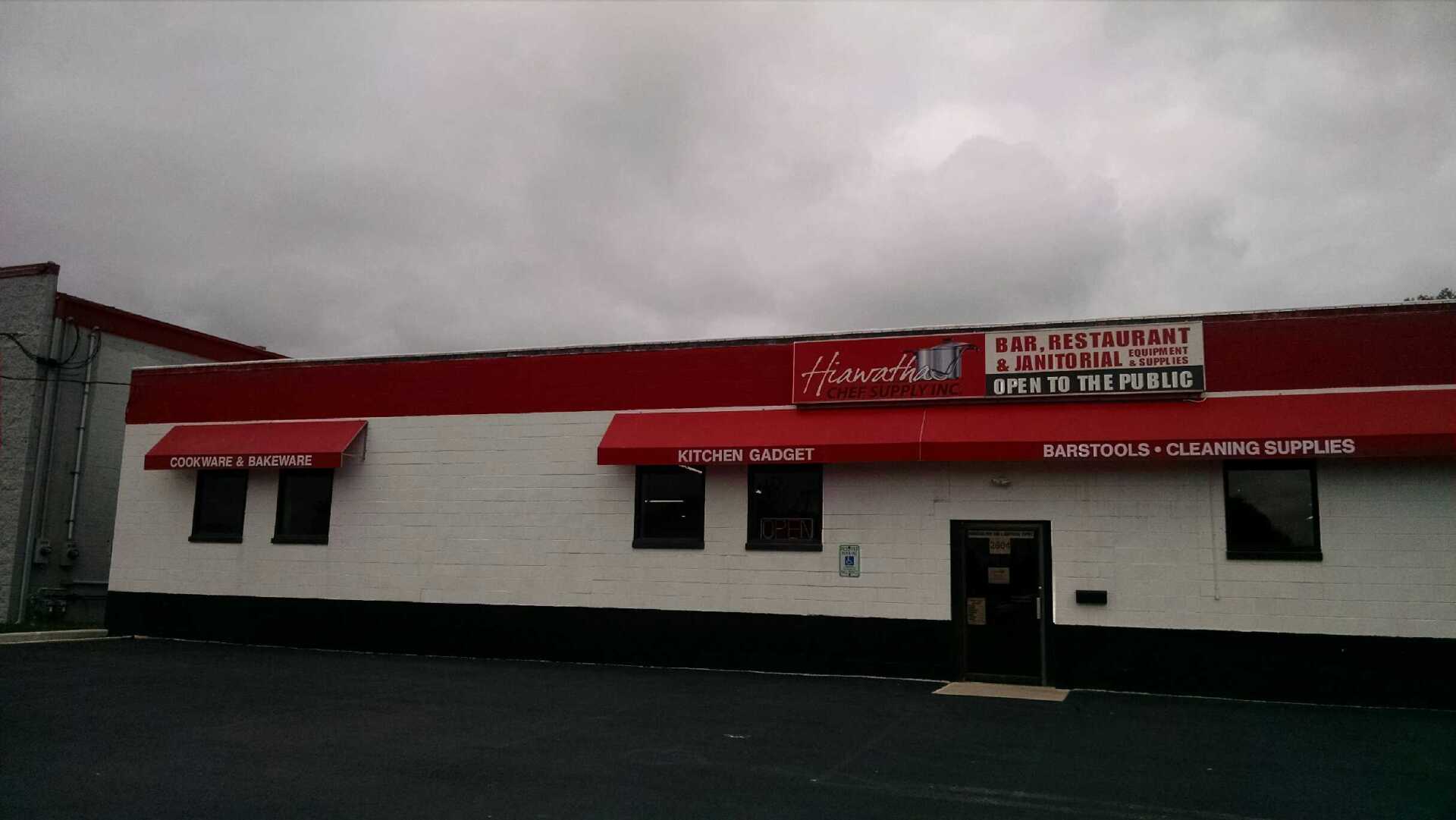 A red awning is on the side of a building