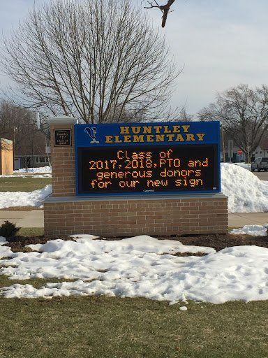 A sign for huntley elementary school in the snow