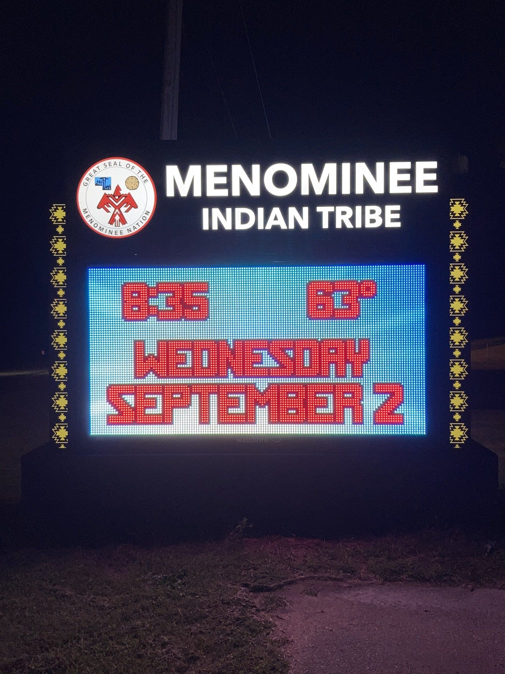 A neon sign for the menominee indian tribe