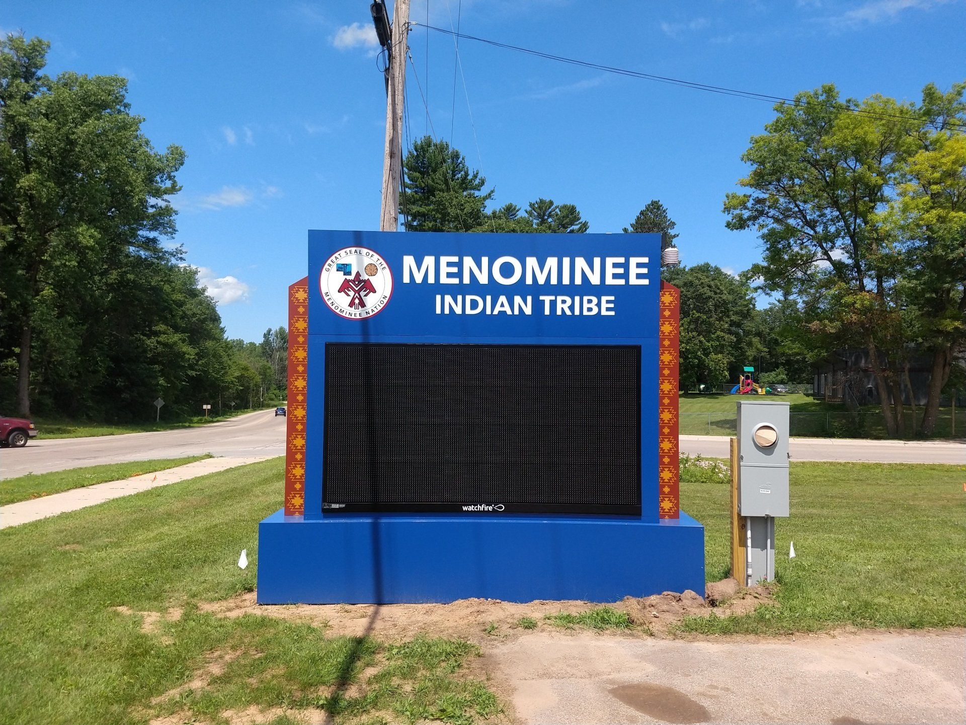 A blue sign for the menominee indian tribe