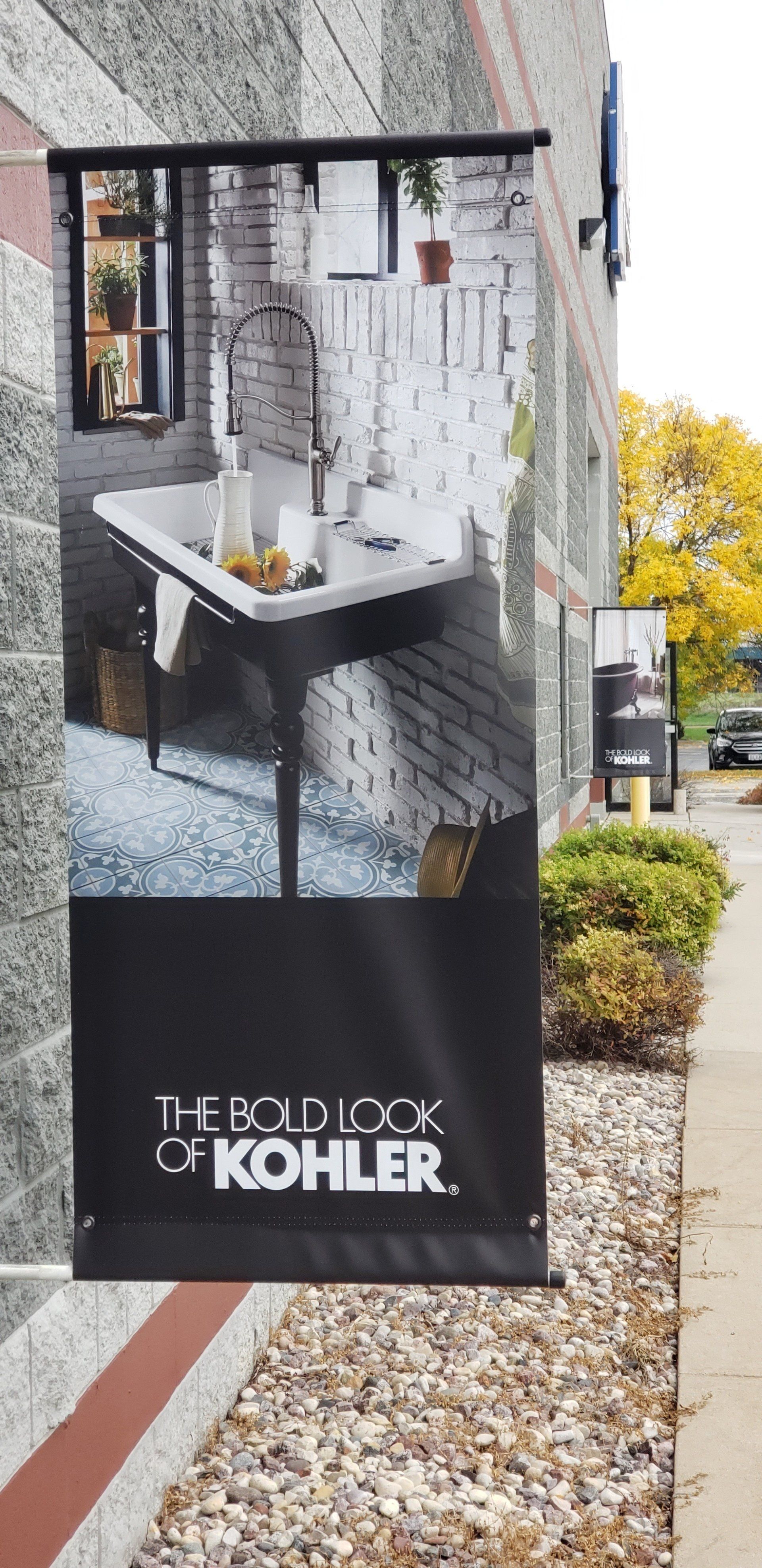 A sign on the side of a building that says the bold look of kohler