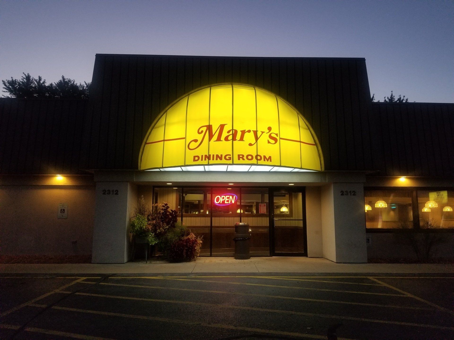Mary 's dining room is lit up at night