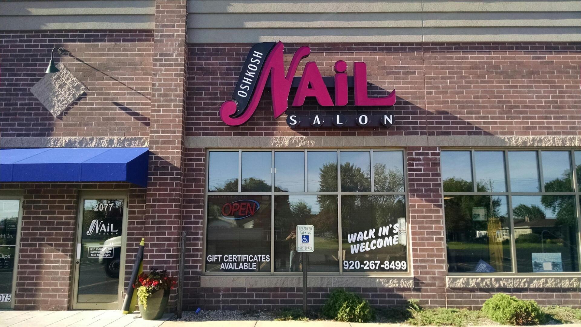 A nail salon is located in a brick building