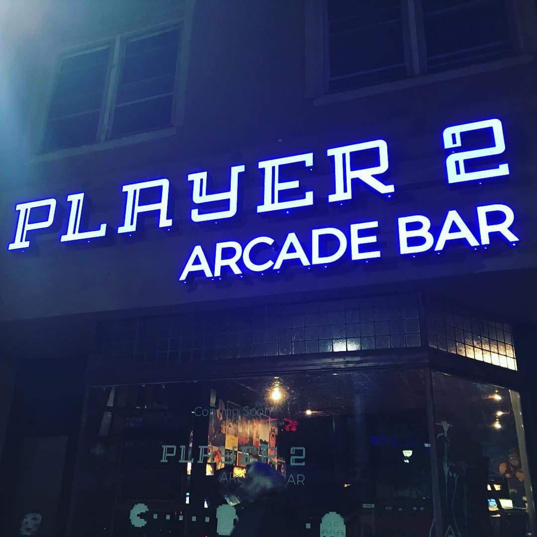 Player 2 arcade bar is lit up at night