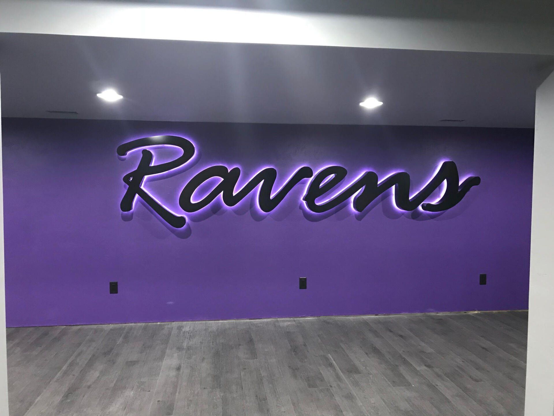 A purple wall with the word ravens on it