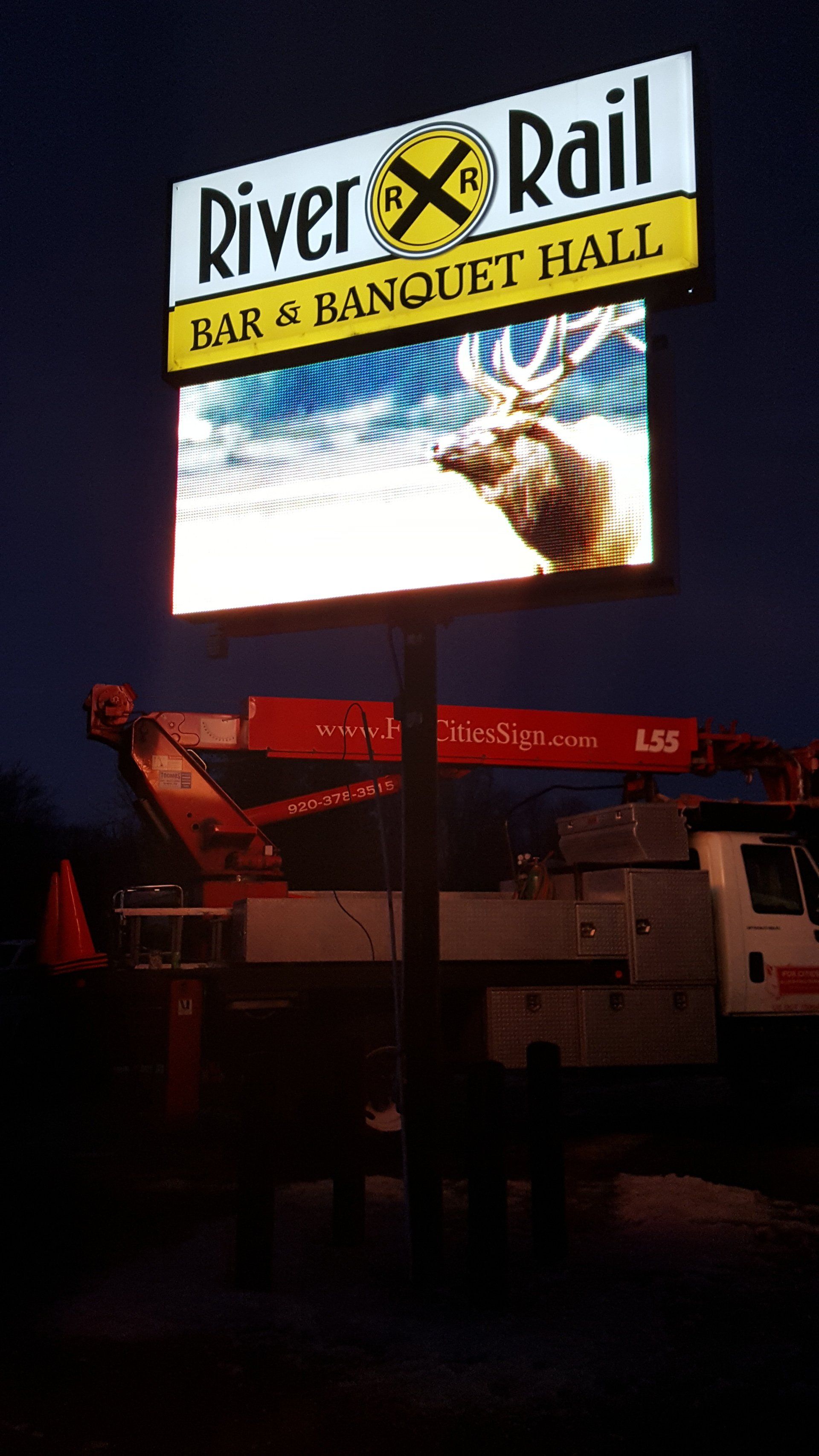 A large sign for river rail has a picture of a deer on it.
