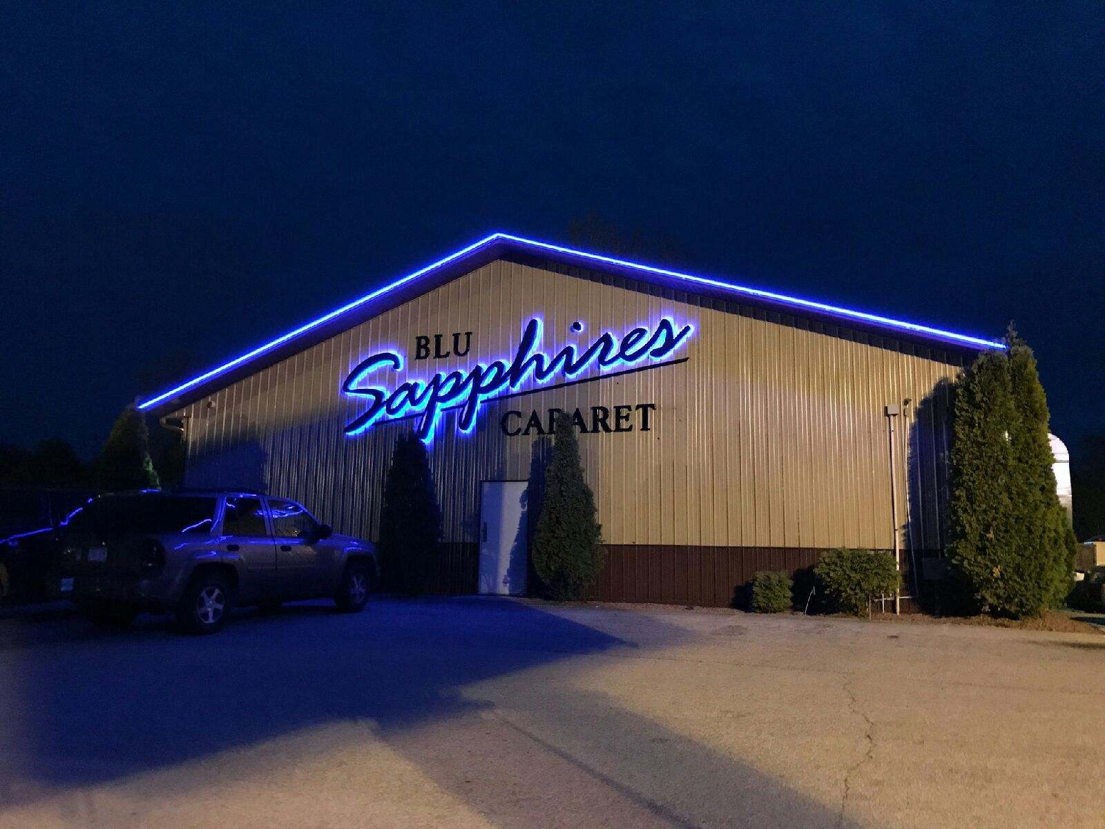 The blue sapphire cabaret building is lit up at night