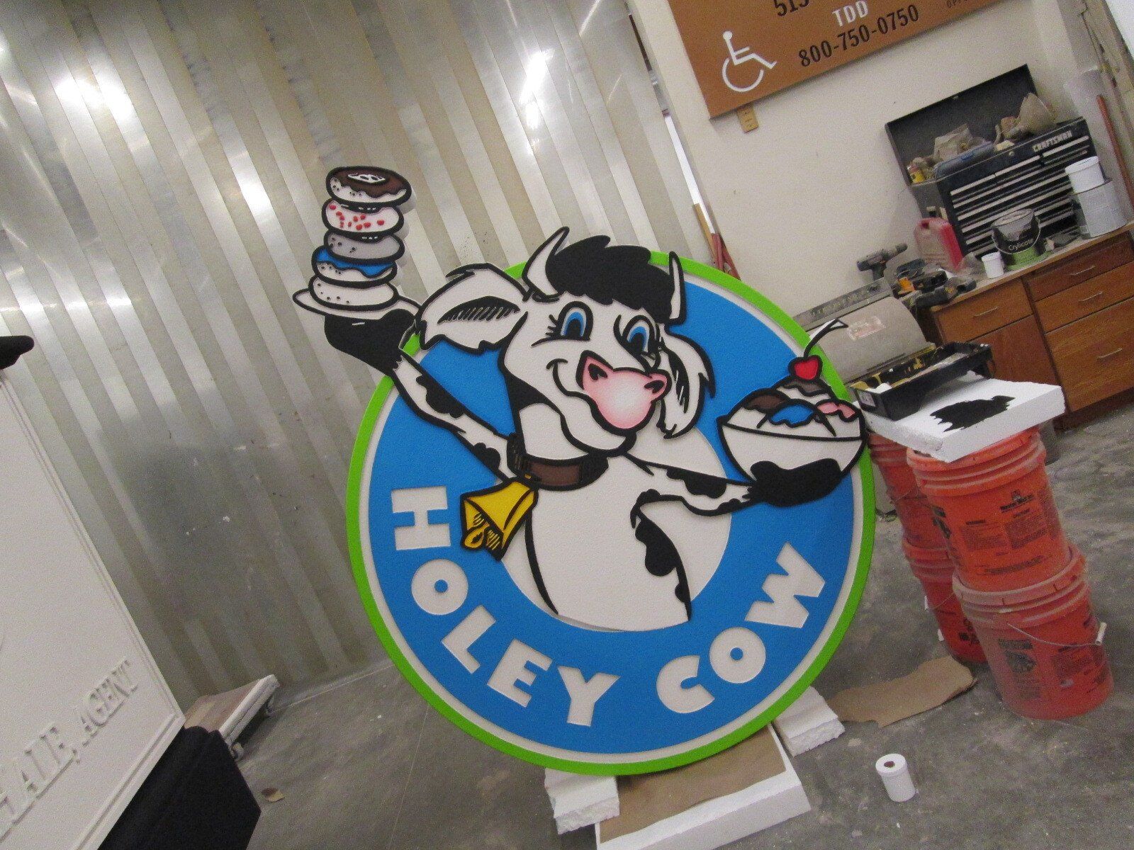 A sign that says holey cow on it