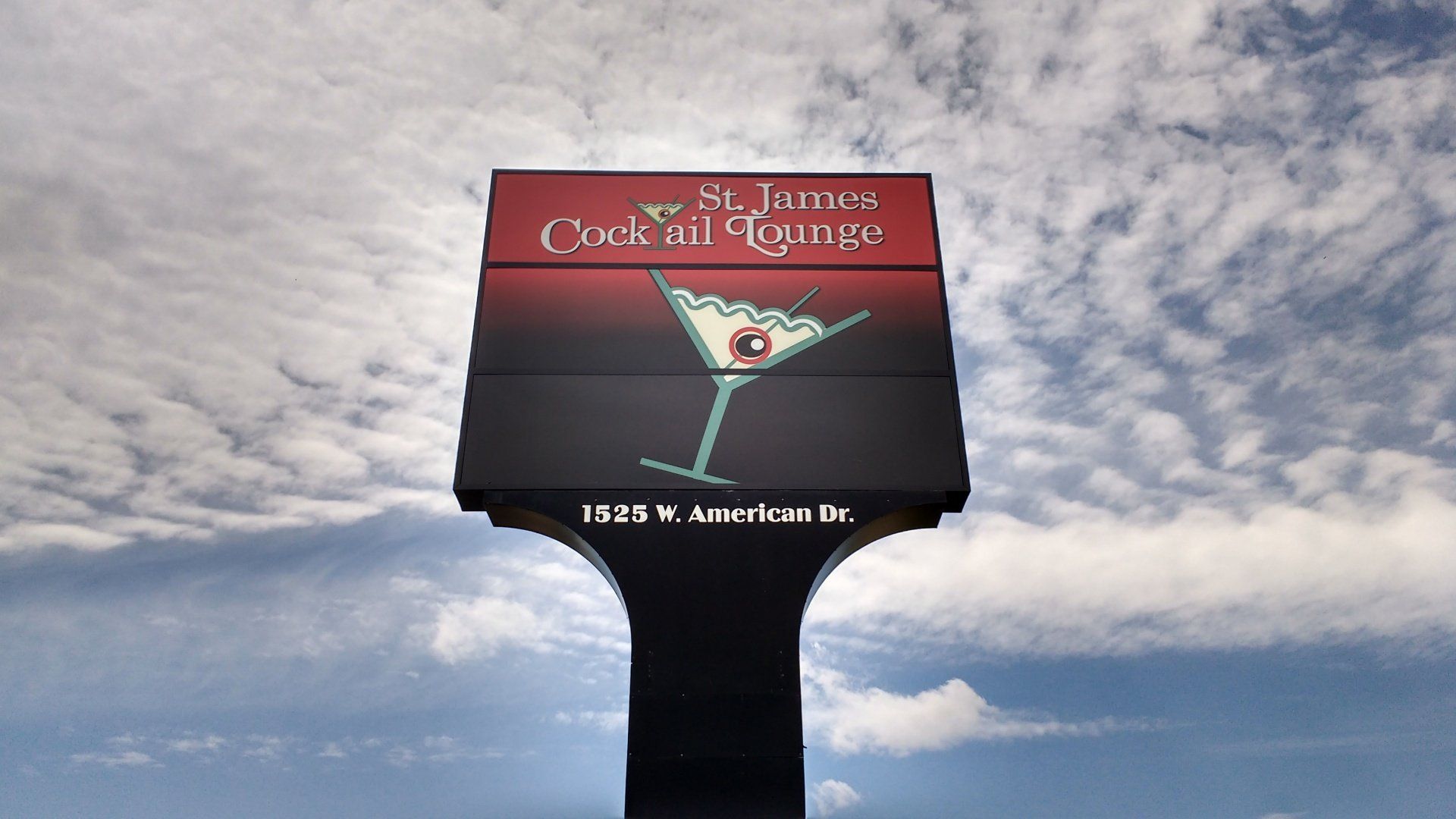 A large billboard for st. james cocktail lounge