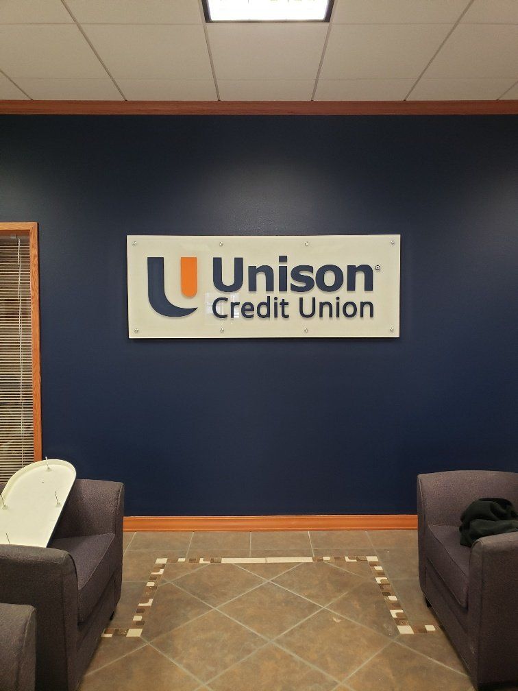 A room with a sign that says unison credit union